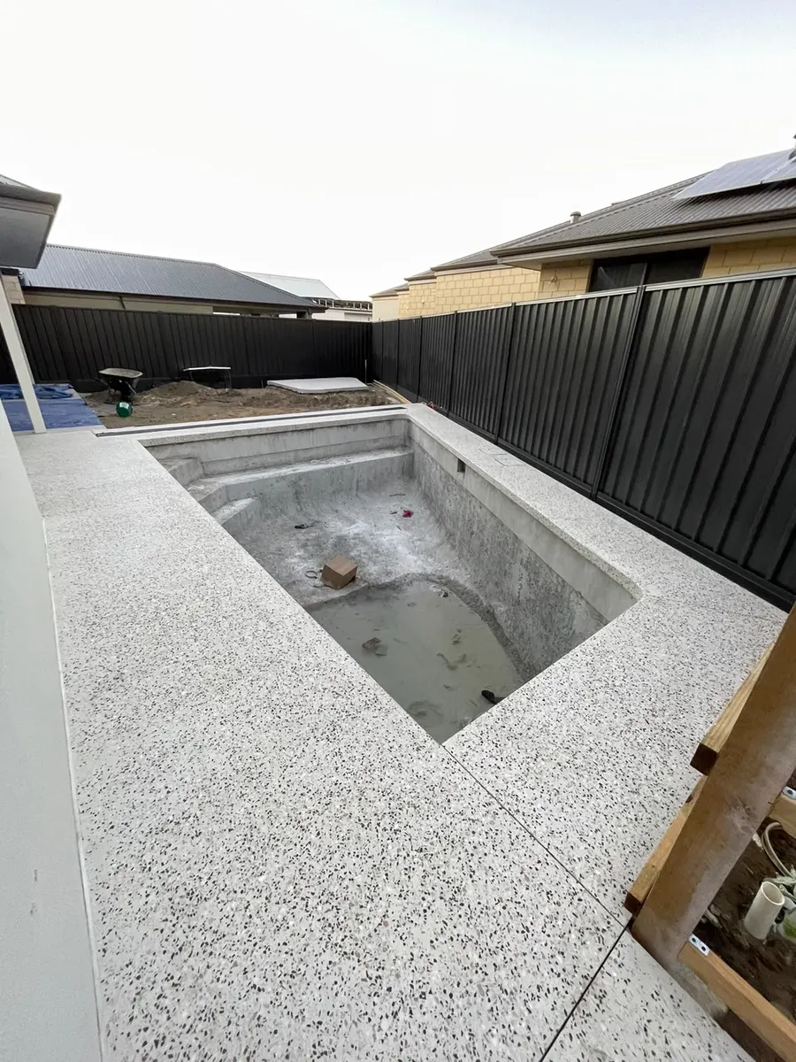 Honed aggregate pool surround in progress, Perth